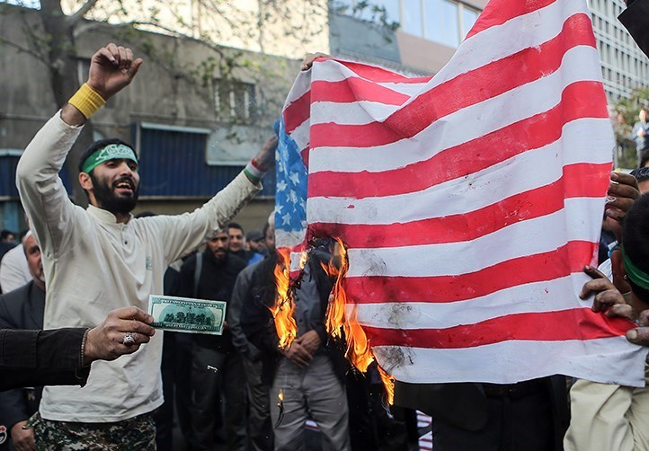 File:Iran burning US flag.png