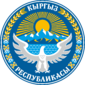 An eagle standing in front of a sun with wheat and cotton and the native name of Kyrgyzstan.